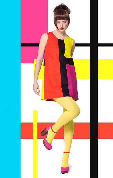 Girl in classic 1960's mod mini sleeveless dress in 4 colour blocks