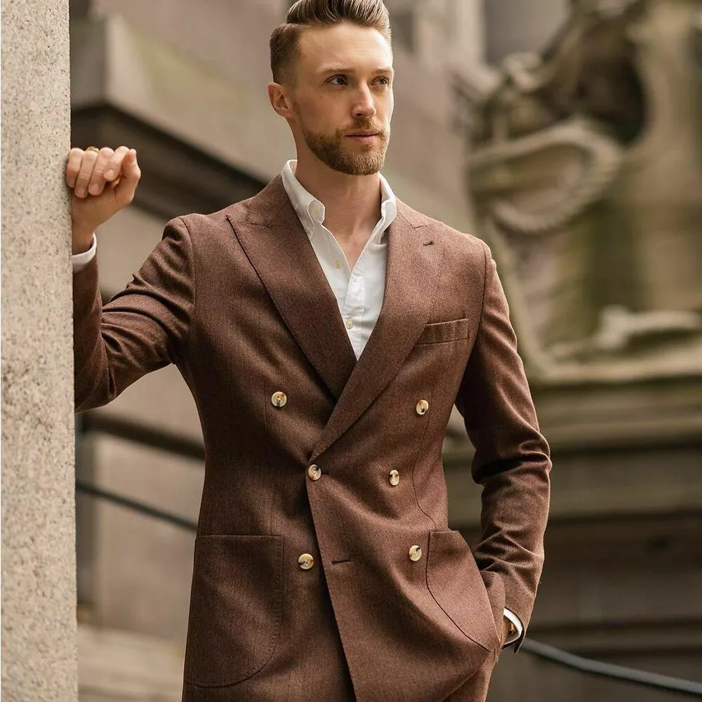 man in double breasted brown suit and white shirt