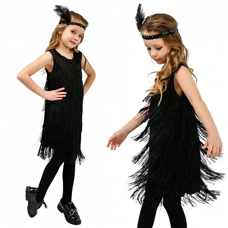 girl dressed in flapper fringed dress feathered headband and black tights