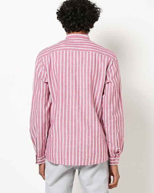 Model wearing pink and white striped shirt