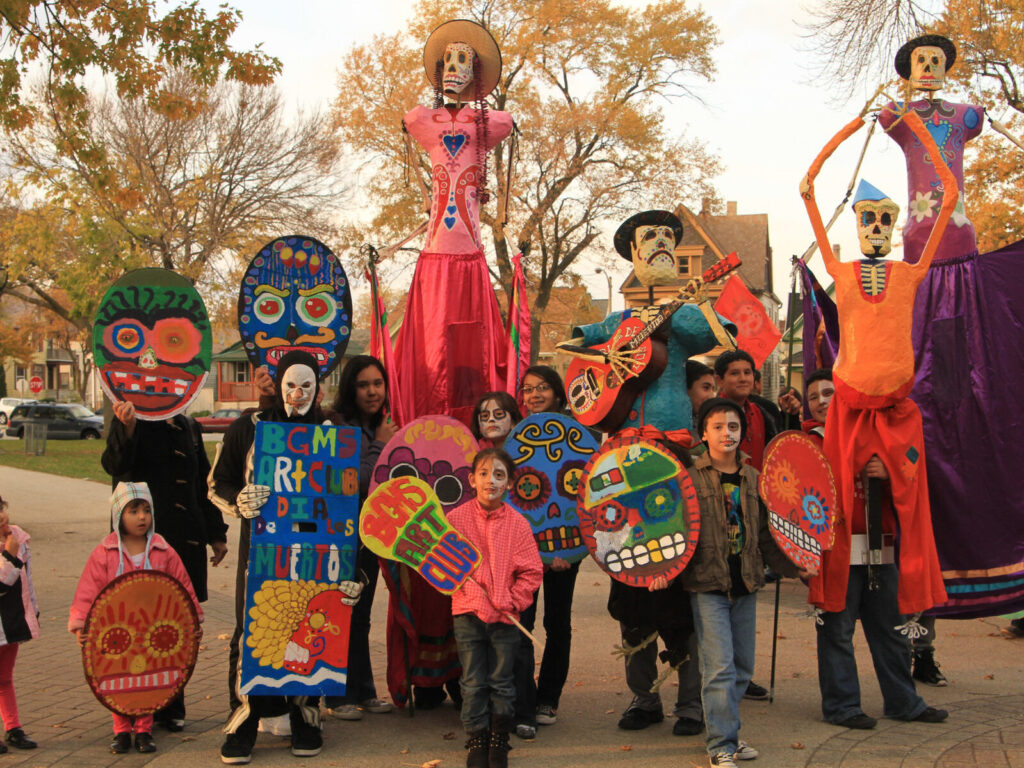 Festival of Dia De Los Muertos in Mexico with costumes and masks