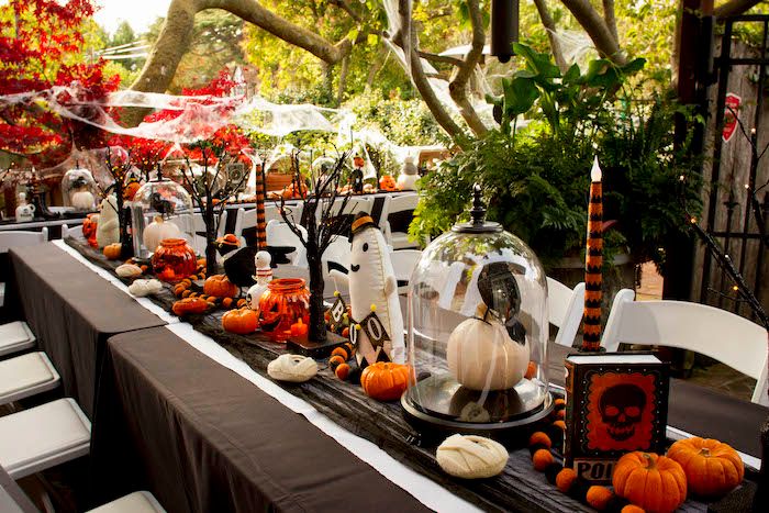 Elaborate outdoor catered halloween party with a lot of attention to detail and seating arrangements