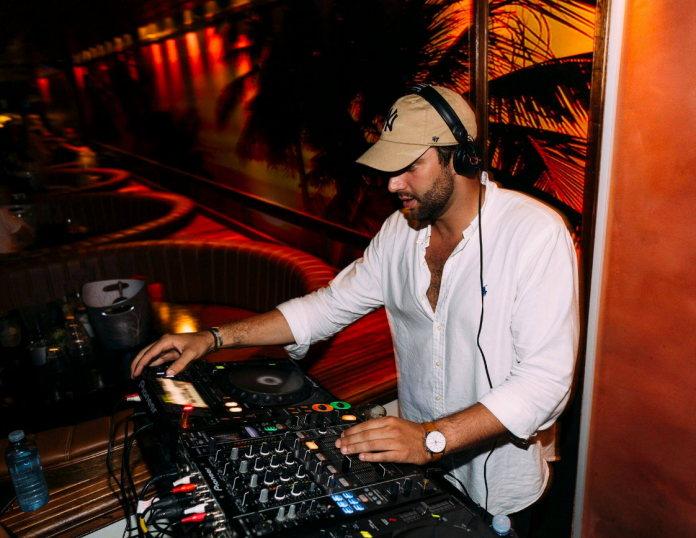 Solo DJ supplying music to race venues