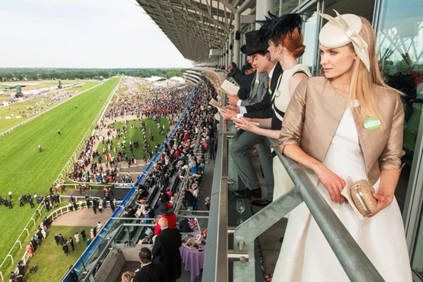 Racegoers on a balcony high in the stands at the Royal Ascot