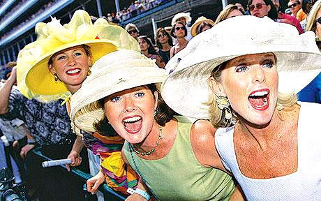 3 ladies cheering their horses at the Guineas in the UK