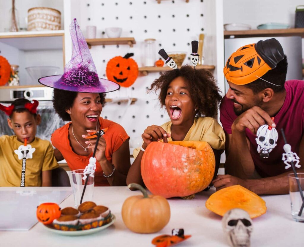 African American family enjoying some halloween festivities at home