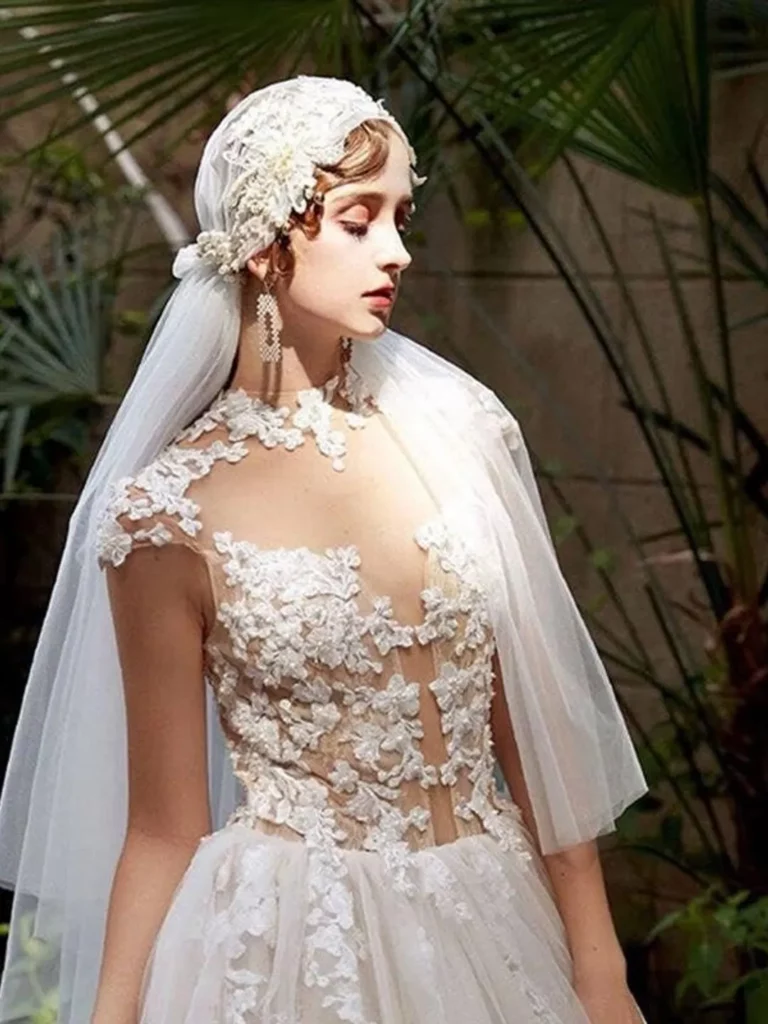 Bride wearing a vintage Juliet cap veil and lace/chiffon dress