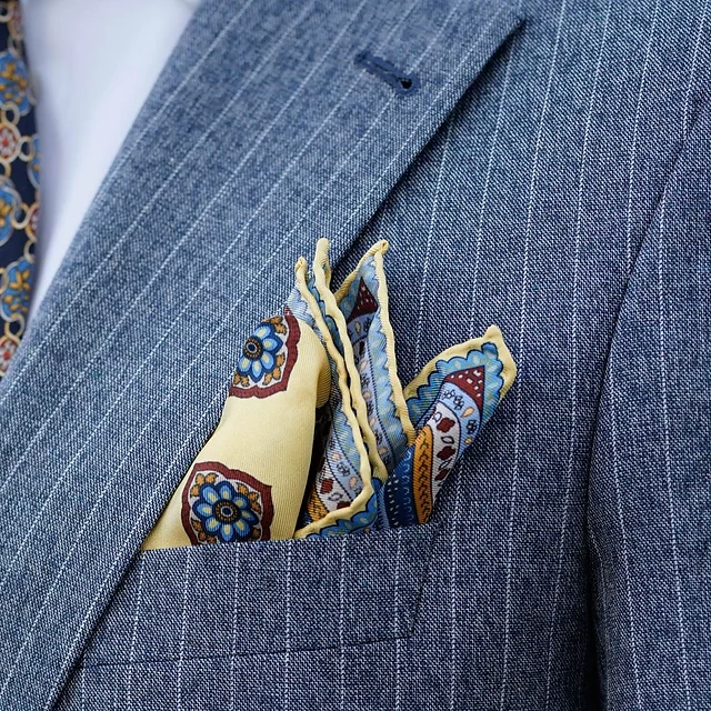 Contrast pocket square in a pin striped blue suit