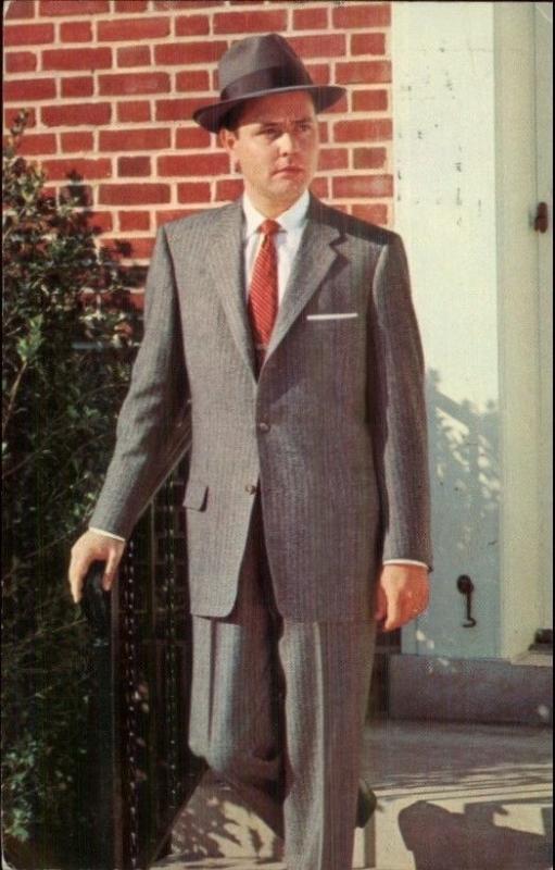 man wearing a tweed suit with baggy pants and a trilby hat