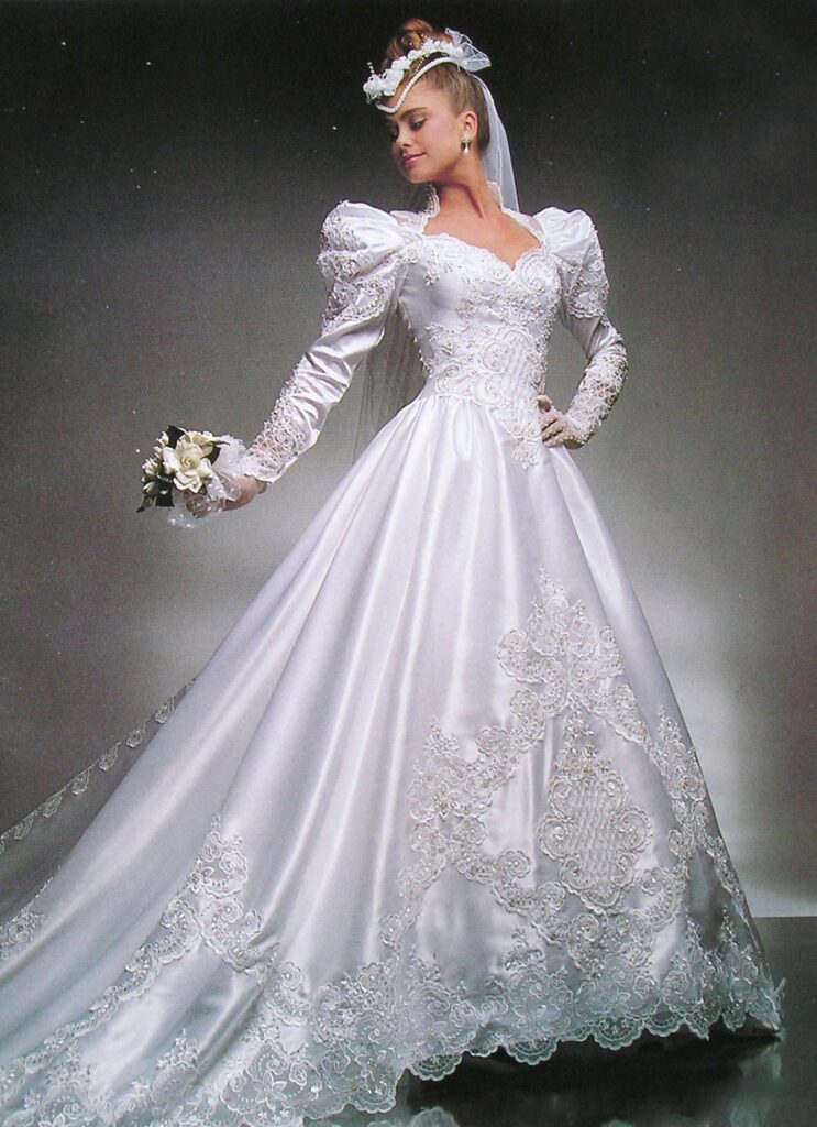 80's bride in white satin A-line gown with sweetheart neck and floral tiara