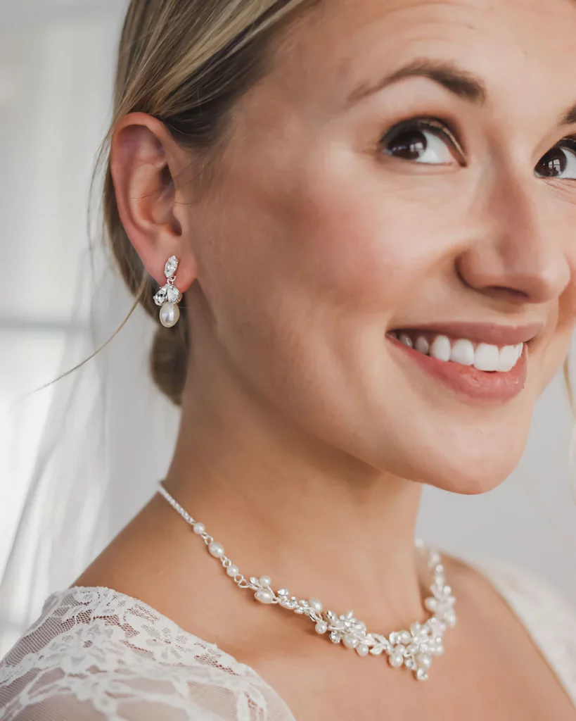 Blonde lady with pear and diamante earrings and necklace set