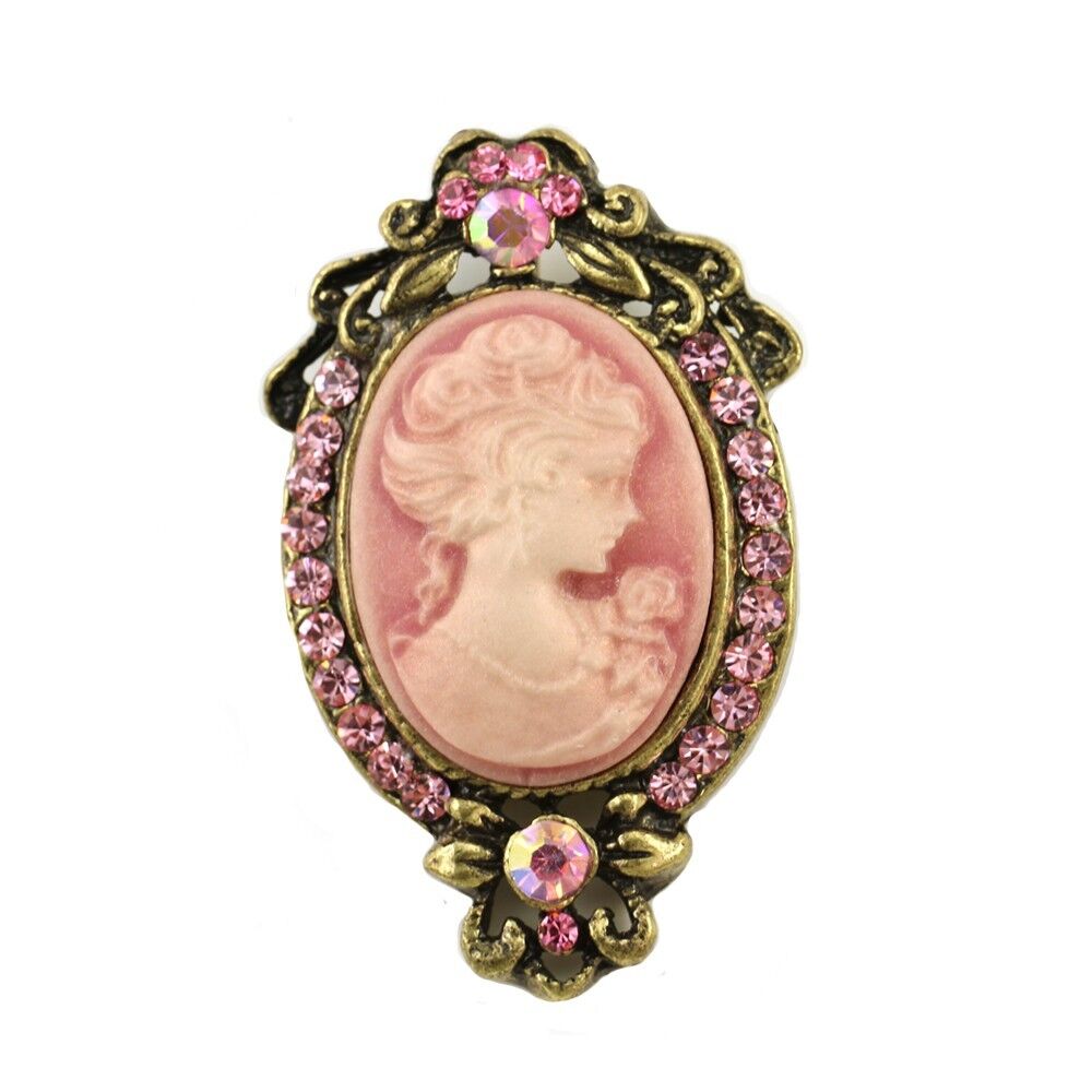 Pink and gold cameo brooch with pink coloured diamonds surrounding it