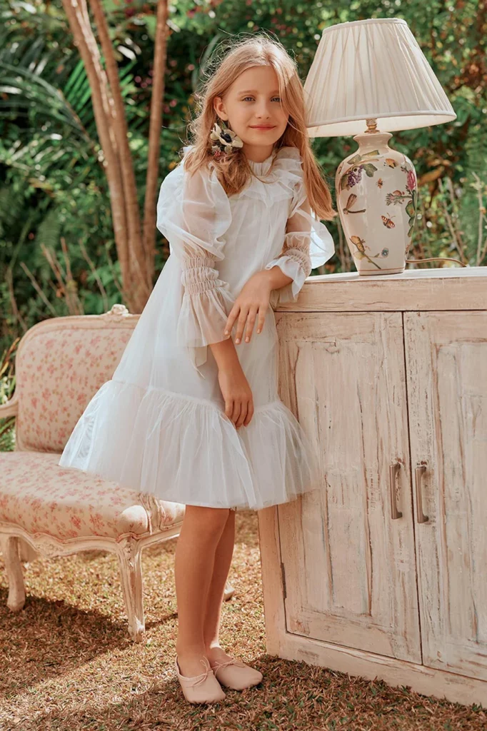 Flower girl with organza empire dress with ruffle skirt and ruffle on sleeves