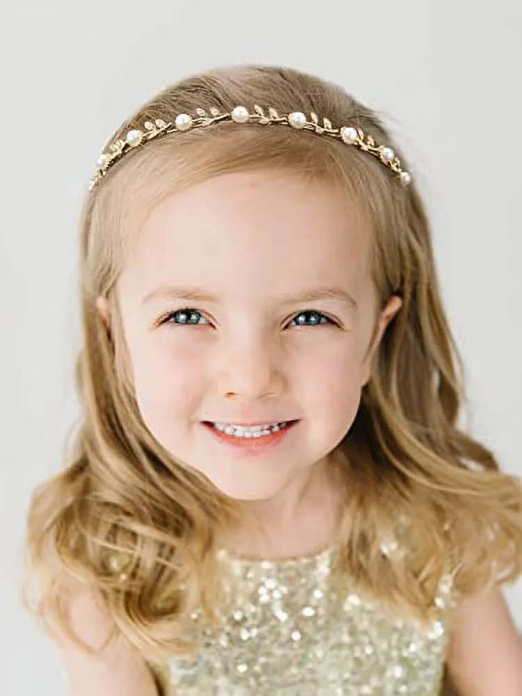 Flower girl with gold and pearl tiara with gold dress