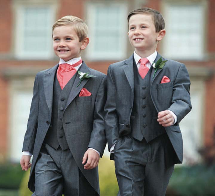 2 boys dressed in 3 piece grey suits with pocket square and tie in salmon