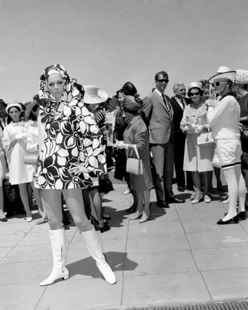 lady modeling mod fashion at the races circa 1960's