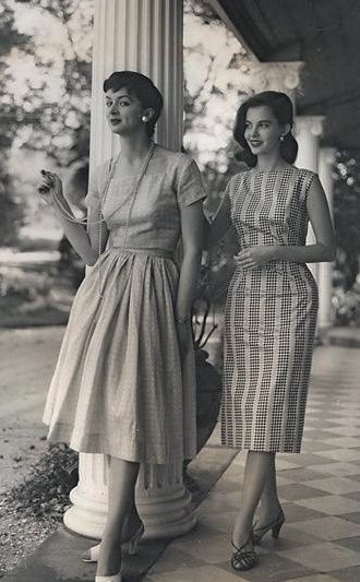 2 women outside a historic building in summer dresses circa late 1950's