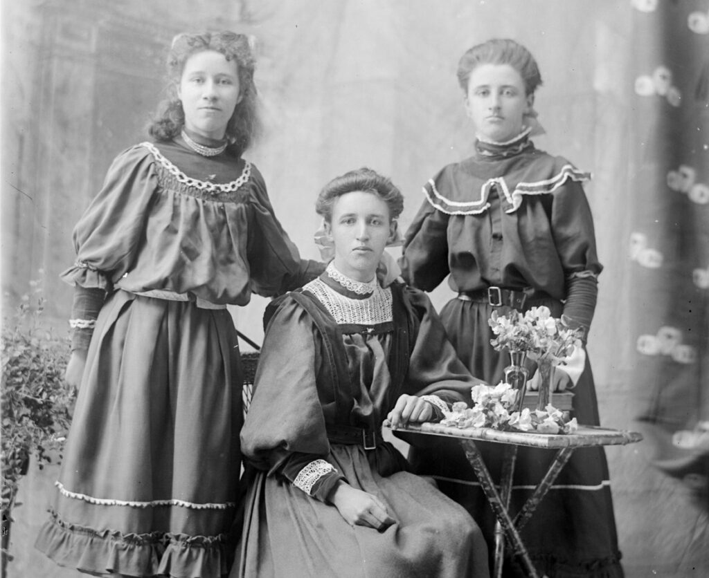 3 Women possibly sisters in early colonial fashion