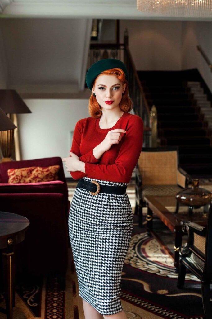 lady in a red long sleeve top with a green beret and a tweed pencil skirt