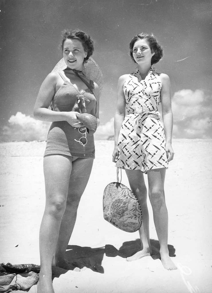 2 ladies on the beach in summer 1950's circa