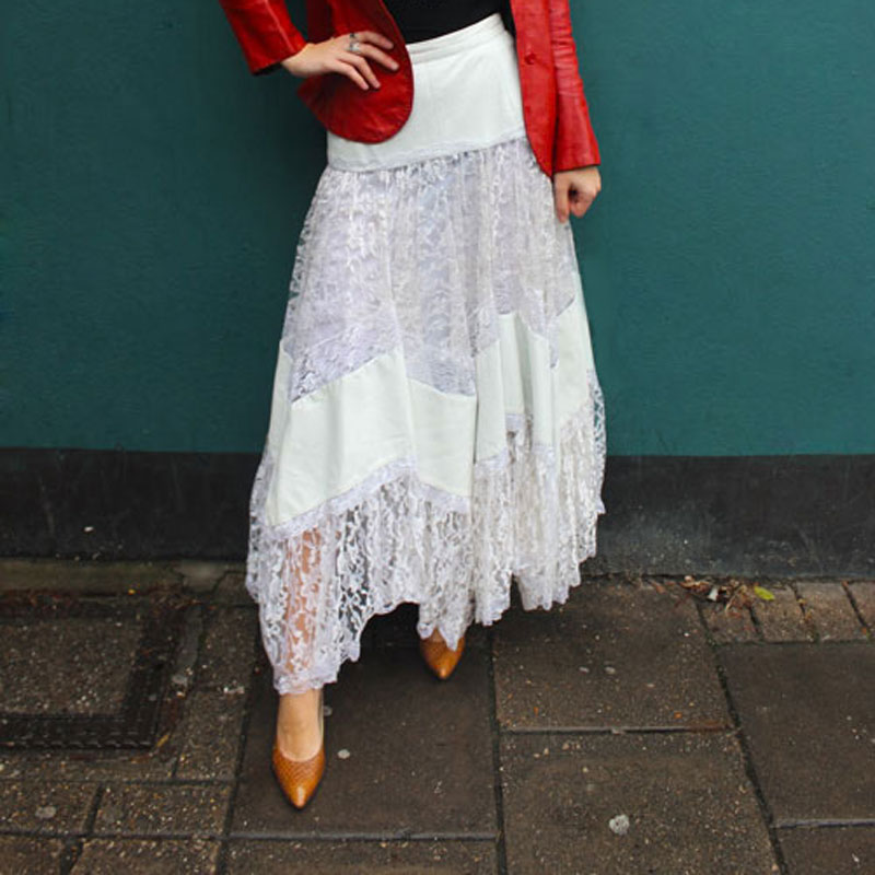 lady in a white lace skirt and red leather jacket