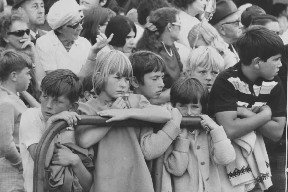 Children squashed against tram railings trying to get a glimpse of the parade - 1970's