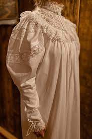 Late 1800's night dress featuring high neck and lace inserts