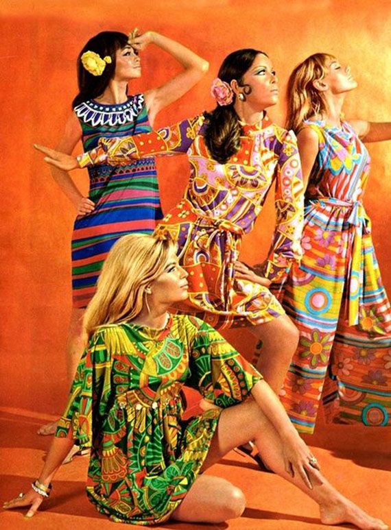 A group of women in psychedelic design pattern dresses