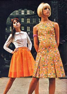 2 ladies in orange toned pleated skirt and dress modelling outside