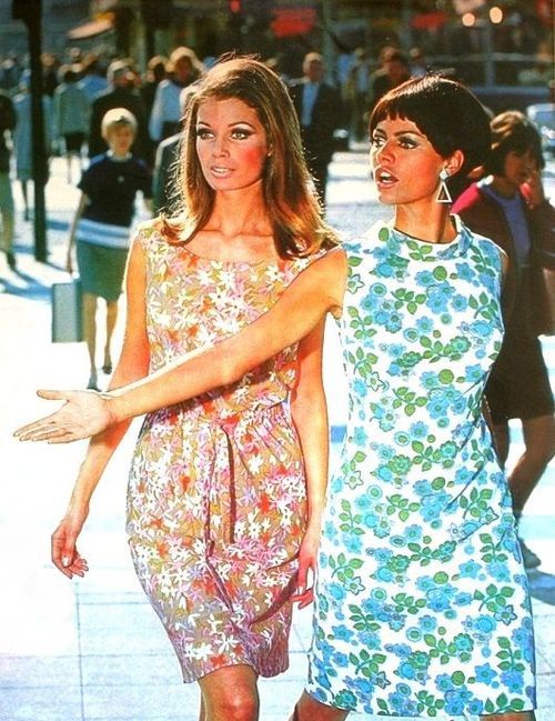 2 ladies in sleevesless mini dresses with floral designs
