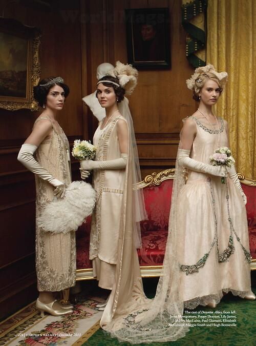 3 cast members in full edwardian transistioning into roaring 20's dresses in neutral tones