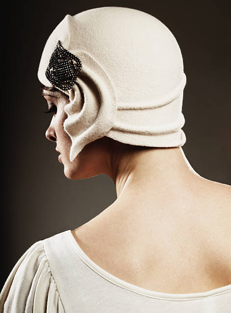 lady in a fitted cloche hats with wide neckline top in ivory colour