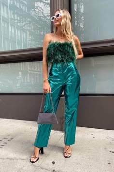 Girl in strapless fluffy top with matching teal lame pants
